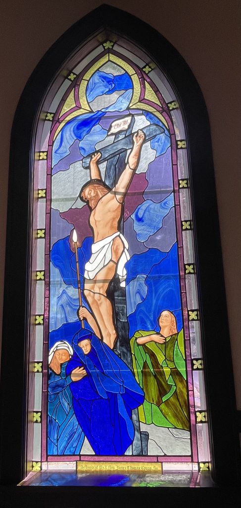 Stained glass window depicting Jesus on the cross