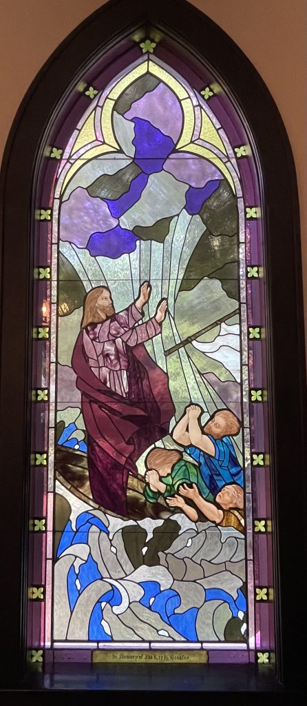 Stained glass art depicting Jesus crossing the Red Sea