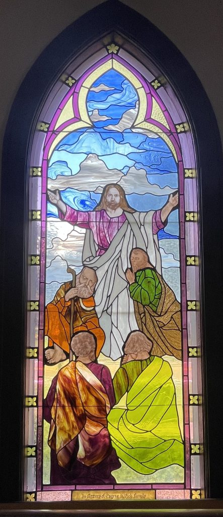 Stained glass window depicting Jesus with his deciples